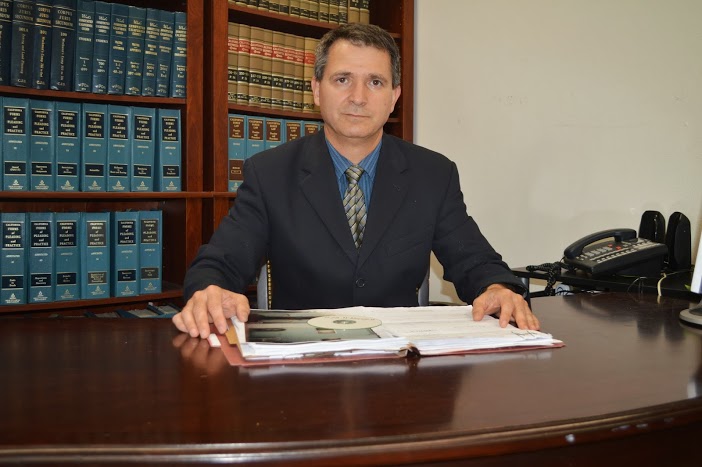 Bahram Madaen, Esq., at his desk